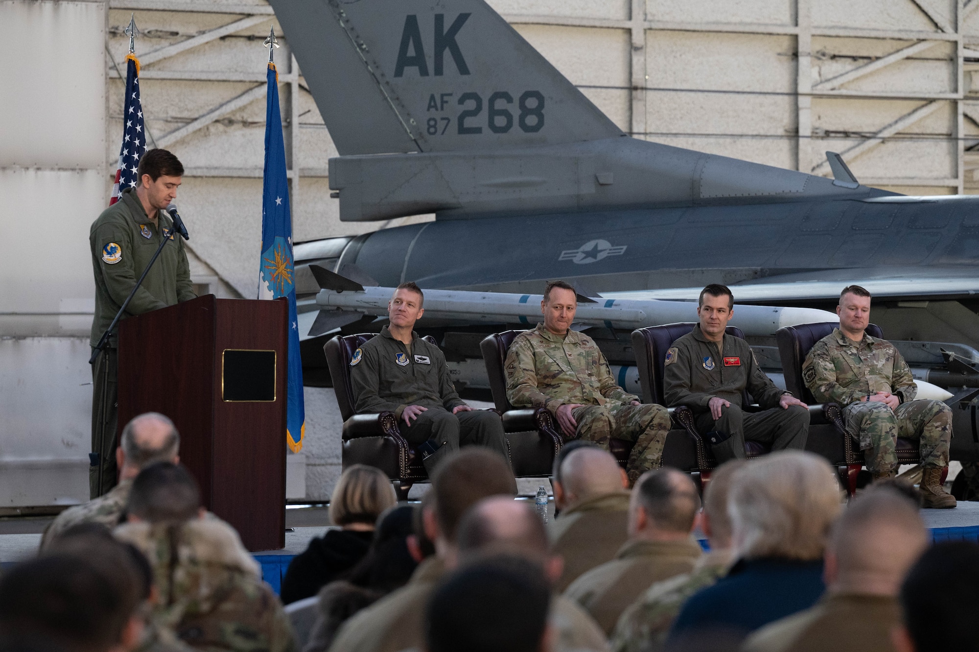 A U.S. Air Force Major introduces members of the official party during a ceremony at Eielson Air Force Base, Alaska.