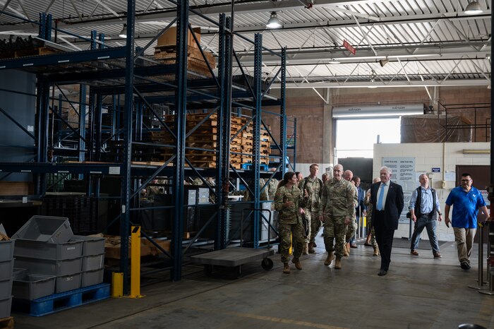 Lt. Col. Monica Moriarity, 647th Logistics Readiness Squadron commander, gives Air Force leaders a tour of Team Hickam’s mobility processing center.