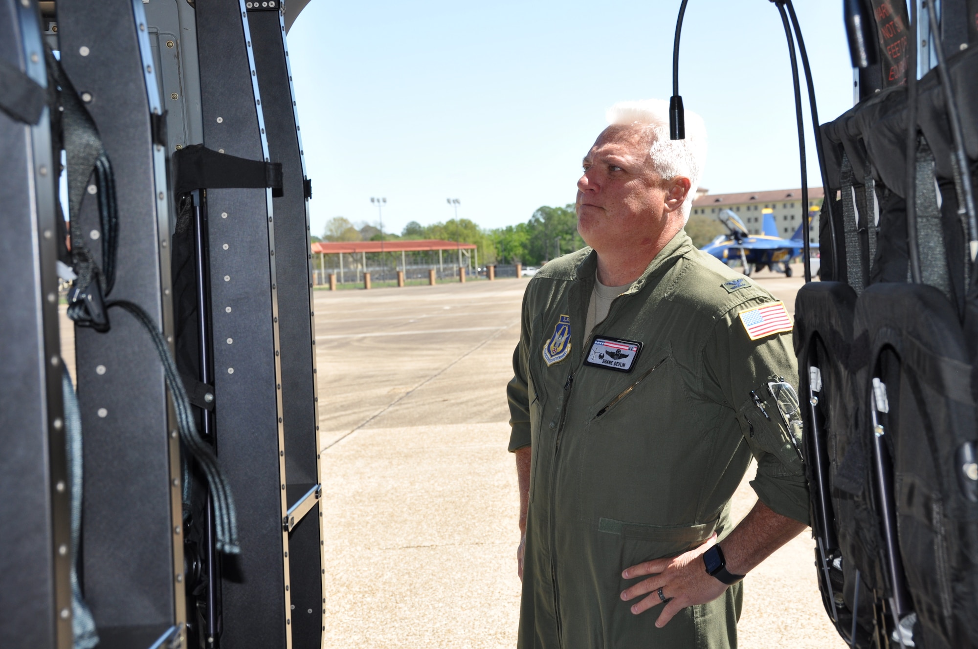 a man looks at a helicopter.