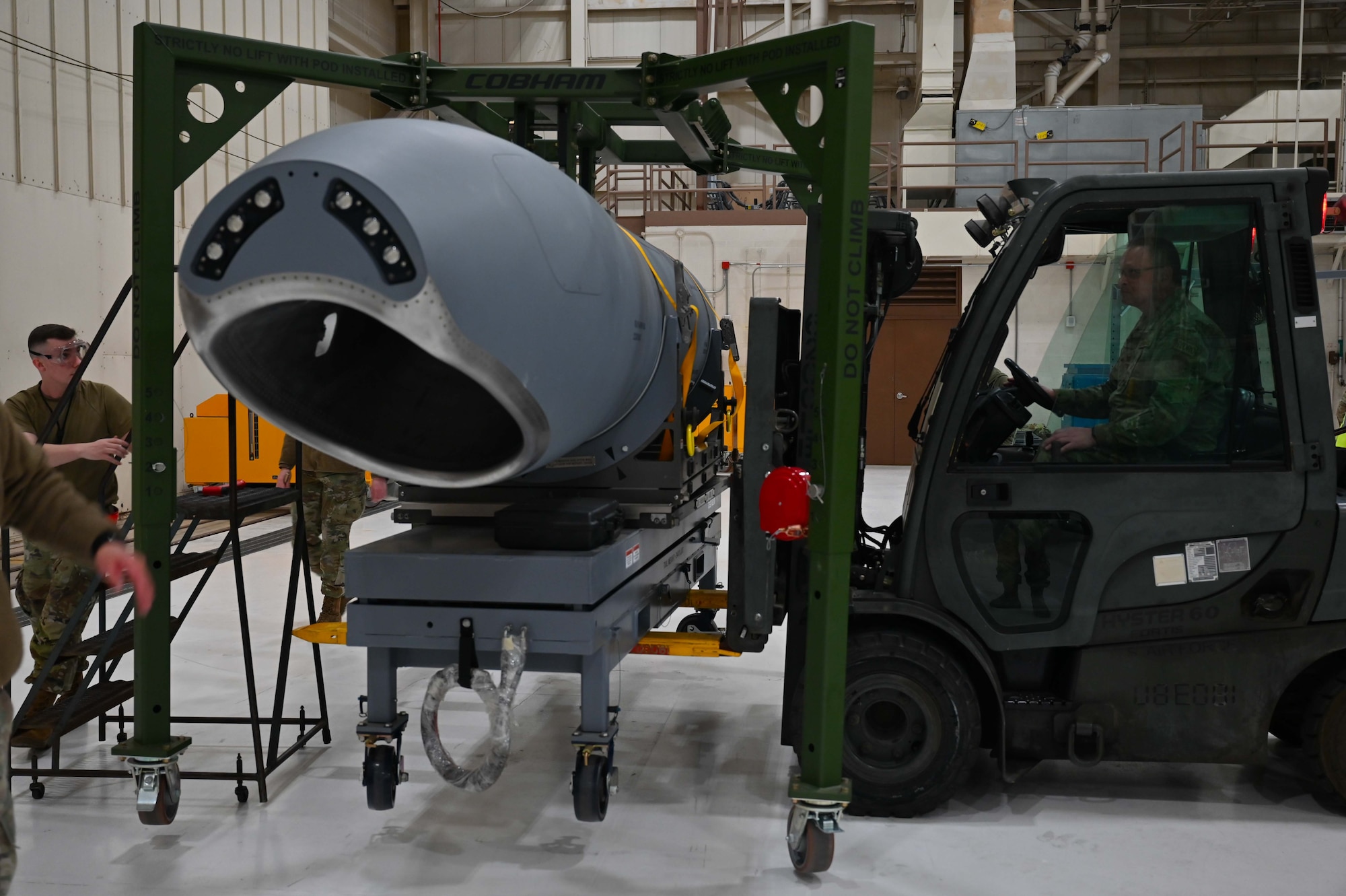 Master Sgt. Shannon Fox, 931st Maintenance Squadron hydraulic section chief, operates a forklift to raise a KC-46A Pegasus Wing Aerial Refueling Pod (WARP) Jan. 24, 2024, at McConnell Air Force Base, Kansas.