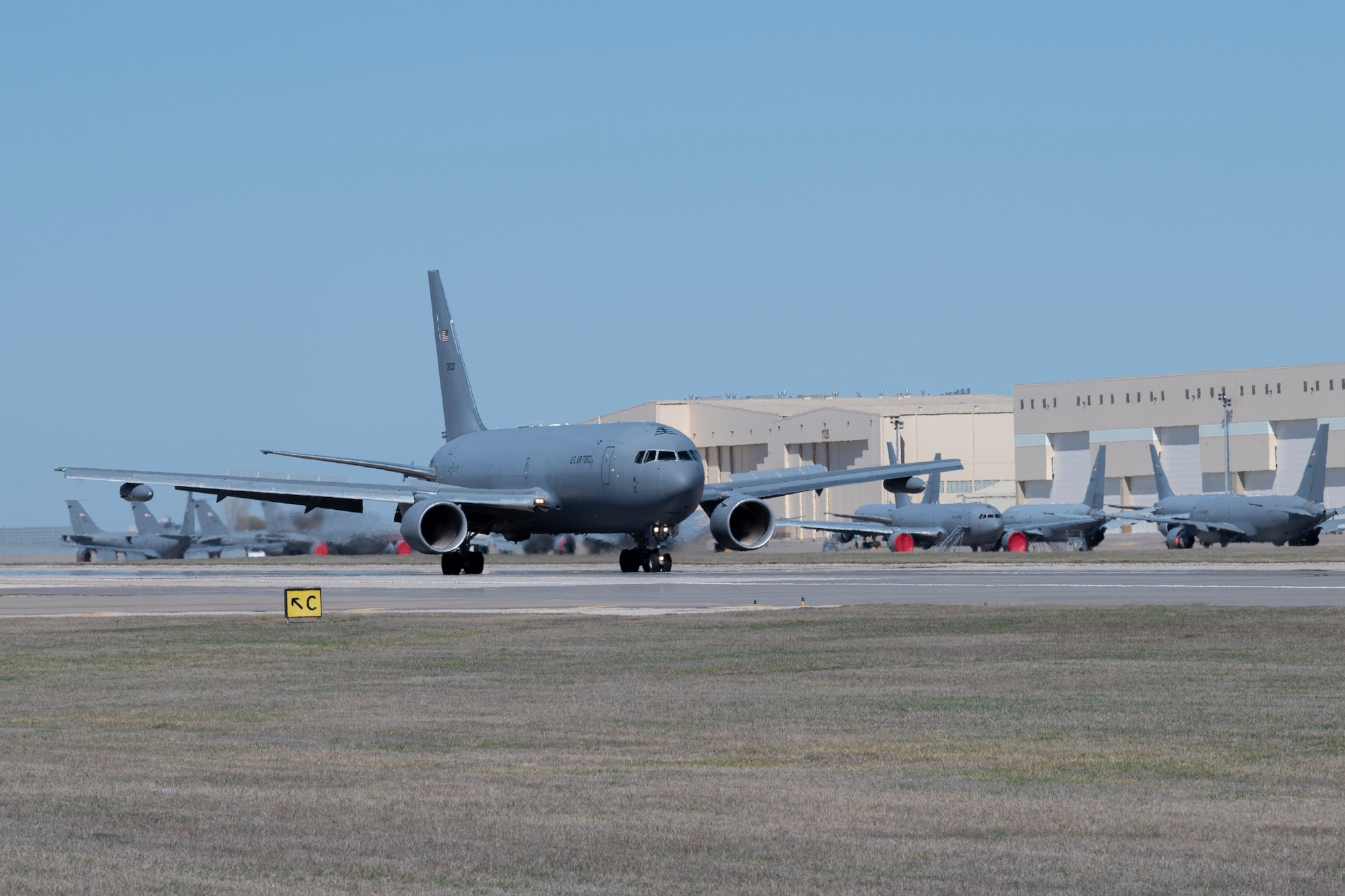 A KC-46A Pegasus, with Wing Aerial Refueling Pods (WARPs) attached, lands on the runway at McConnell Air Force Base, Kansas March 19, 2024.