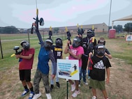 young paintball players cheer