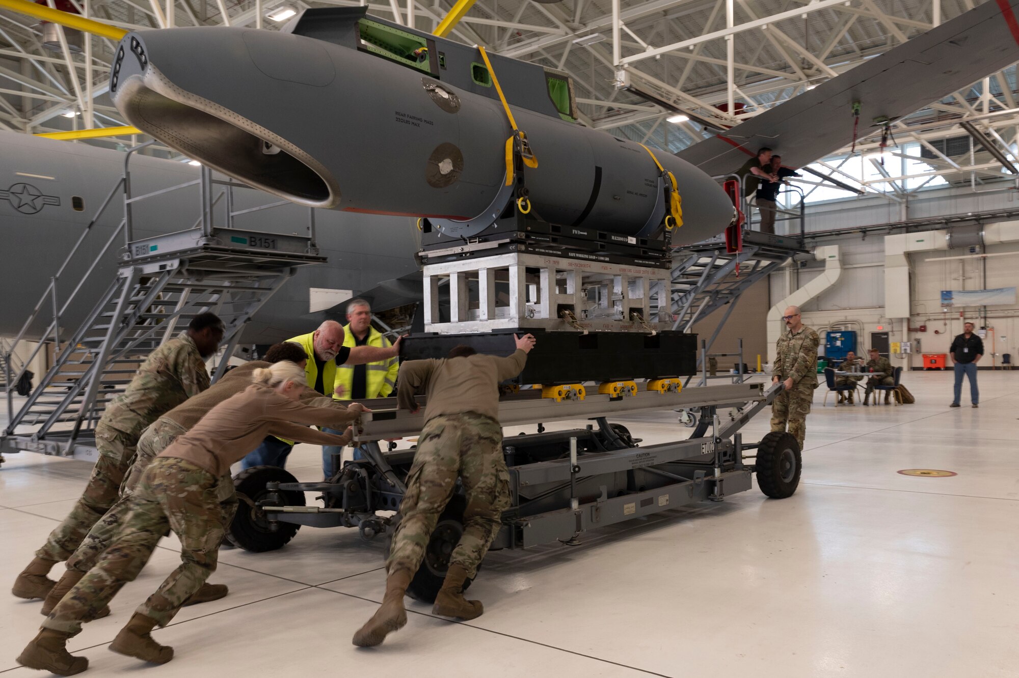 Airman from the 22 Maintenance Group push a Wing Aerial Refueling Pod (WARP) March 5, 2024, at McConnell Air Force Base, Kansas.