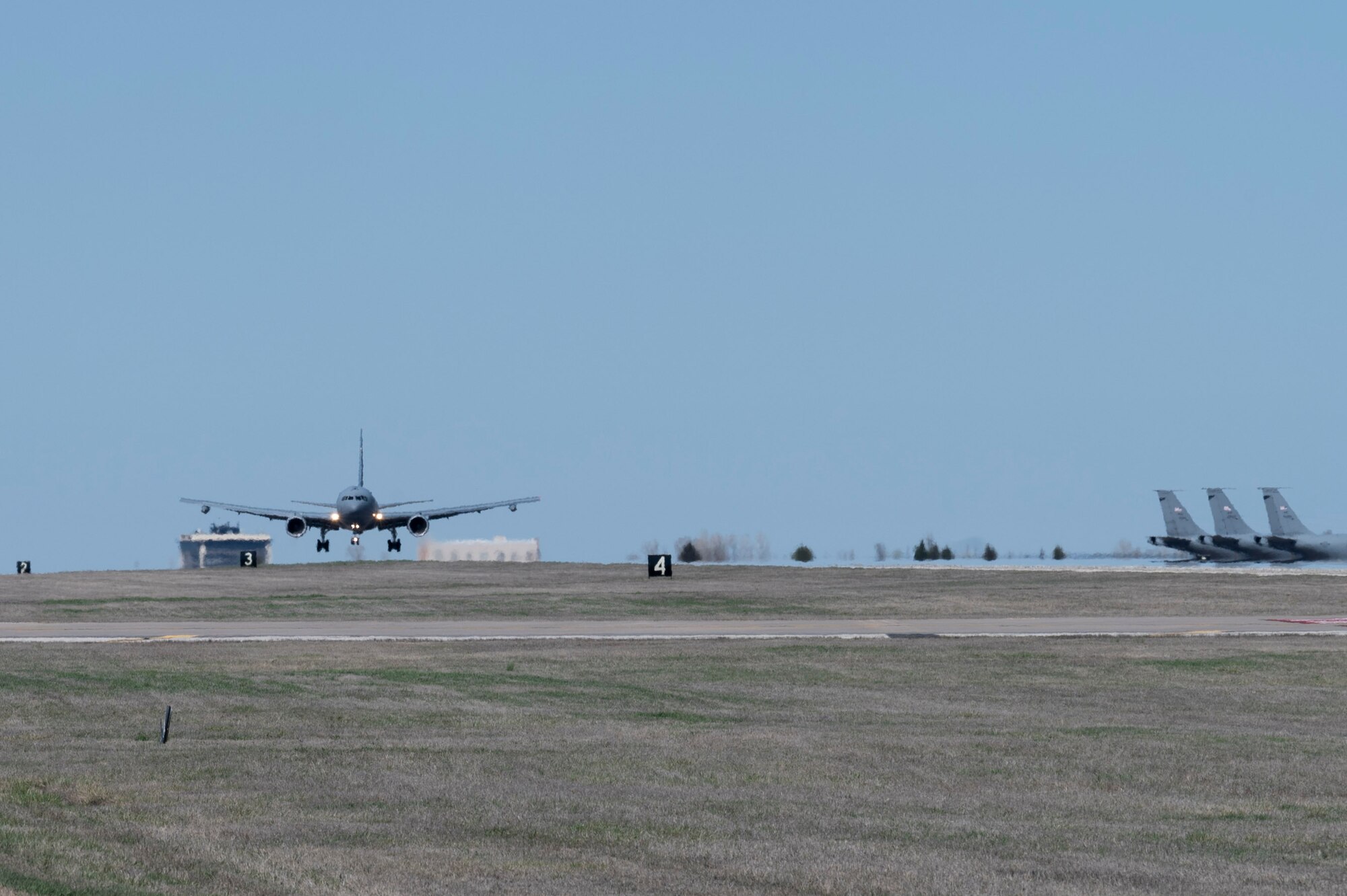 A KC-46A Pegasus, with Wing Aerial Refueling Pods (WARPs) attached, lands on the runway at McConnell Air Force Base, Kansas March 19, 2024.
