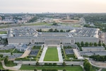 five-sided building is photographed from above.