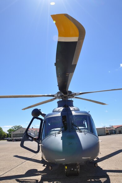 a helicopter parks on a flight line