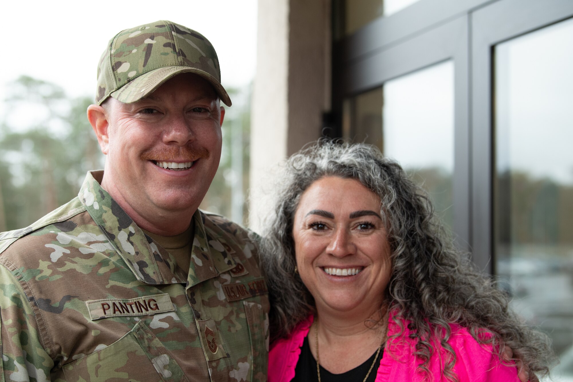 captain poses for photo with husband