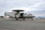 An E-2C Hawkeye, assigned to Naval Aviation Warfare Development Command (NAWDC) Carrier Airborne Electronic Warfare Weapons School (CAEWWS), taxis on the runway at Naval Air Station Fallon, Jan. 26, 2024. Home to the Fighting Saints of Fighter Squadron Composite 13 (VFC-13) and the Naval Aviation Warfare Development Command (NAWDC), NAS Fallon serves as the Navy’s premier tactical air warfare training center.