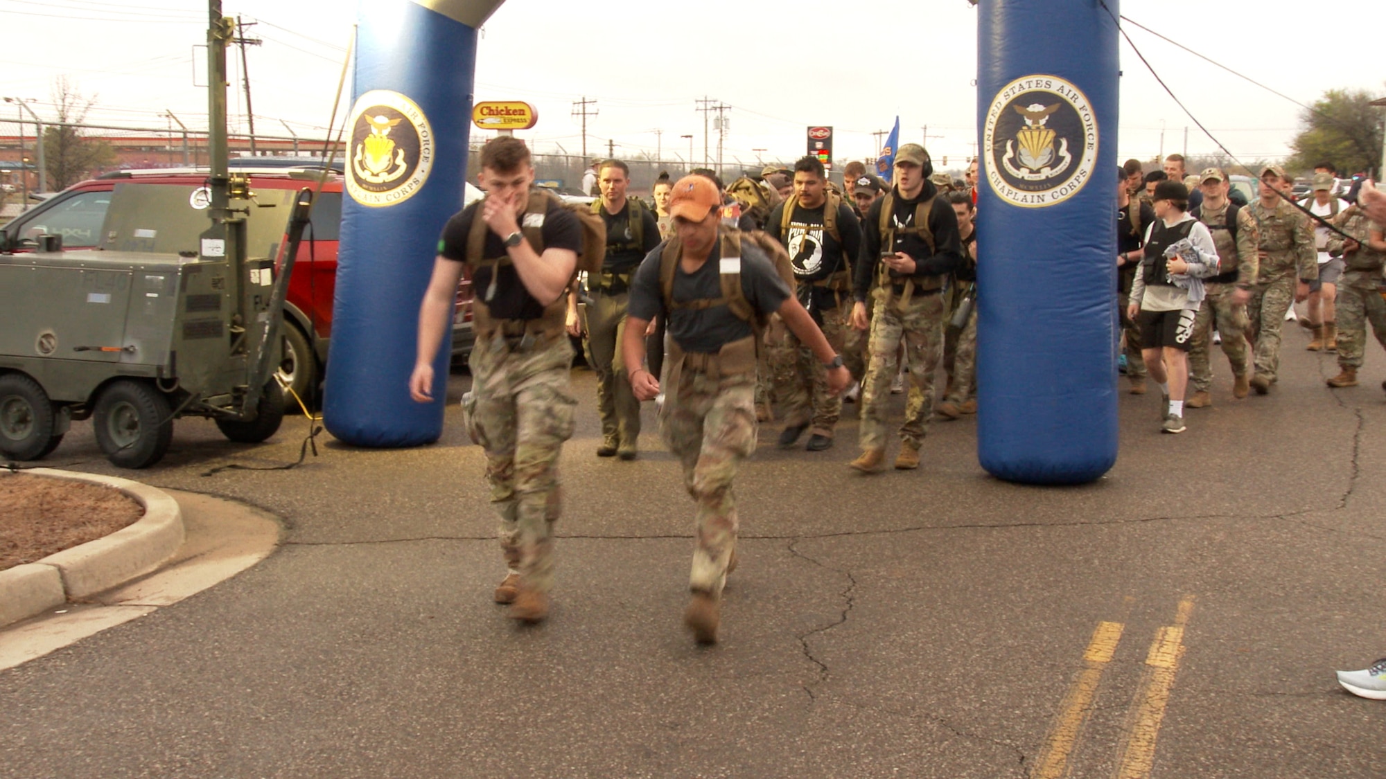 people walking with backpacks on