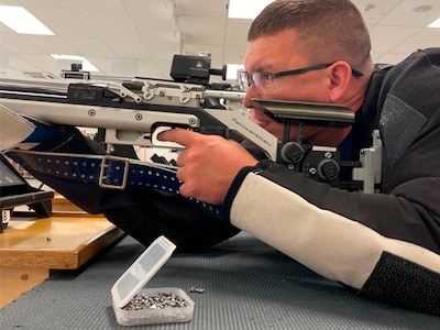 Staff Sgt Travis Beeghley takes aim during air rifle practice.