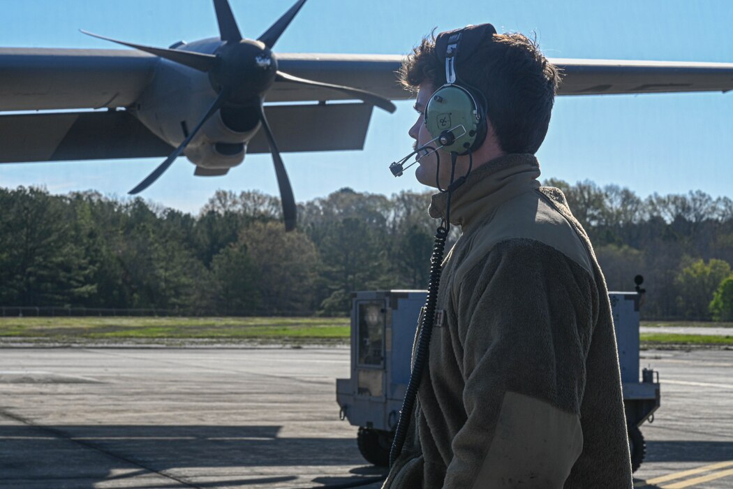 An Airman stands on the flightline