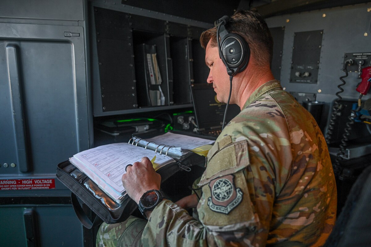 An Airman writes on a piece of paper