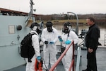 Soldiers and Airmen assigned to the 2nd Weapons of Mass Destruction Civil Support Team complete a communication check before executing an exercise aboard the USS Slater museum ship in Albany, New York, March 28, 2024. The CST Soldiers and Airmen worked with the New York State Police and the Federal Bureau of Investigation to identify radiological sources aboard the ship during the joint training exercise.