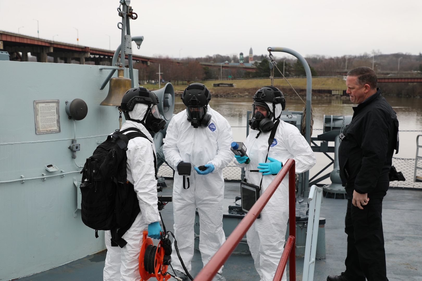 Soldiers and Airmen assigned to the 2nd Weapons of Mass Destruction Civil Support Team complete a communication check before executing an exercise aboard the USS Slater museum ship in Albany, New York, March 28, 2024. The CST Soldiers and Airmen worked with the New York State Police and the Federal Bureau of Investigation to identify radiological sources aboard the ship during the joint training exercise.