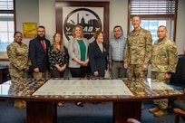 Members of the Office of the Deputy Assistant Secretary of Defense for Housing and command leadership from JBAB pose for a photo