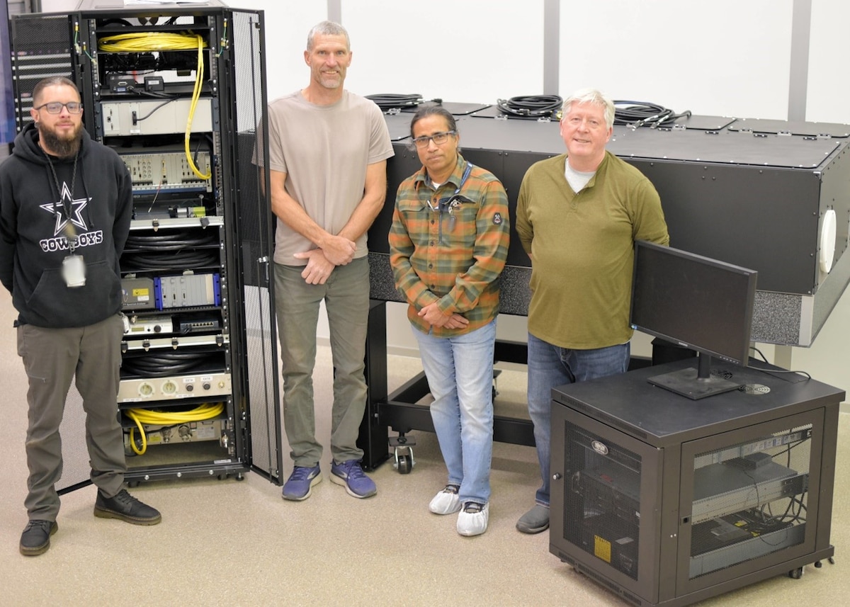 From left: Dominick Fasulo, BAE facilities specialist; Chuck Dahl, BAE electrical engineer; Debashis Satpathi, Government Radiometrically-Accurate Instrument for Laser Evaluation Version II, or GRAILE-II, program manager; and Ian Lee, GRAILE-II technical lead at BAE Systems, before transporting GRAILE-II to the Air Force Research Laboratory for system acceptance, ‎Feb. ‎27, ‎2024. The GRAILE-II diagnostic system will be used to validate the performance of the Department of Defense’s most powerful high-energy laser systems. (Courtesy photo / Gina Schreiner)