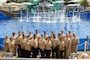 Sailor of the Year (SOY) candidates and their Chief Petty Officers take a picture with the dolphins at the SeaWorld in San Diego during a three-day Sailor of the Year (SOY) tour, March 28, 2024. The Sailors were all selected as their installation's Sailor of the Year and were in San Diego to compete for the title of Navy Region Southwest SOY. The Sailor selected as the Navy Region Southwest SOY will compete against the other regional SOYs to become Commander, Navy Installation Command's SOY and earn a meritorious promotion to Chief Petty Officer. (U.S. Navy photo by Mass Communications Specialist 3rd Class Victoria Danser)