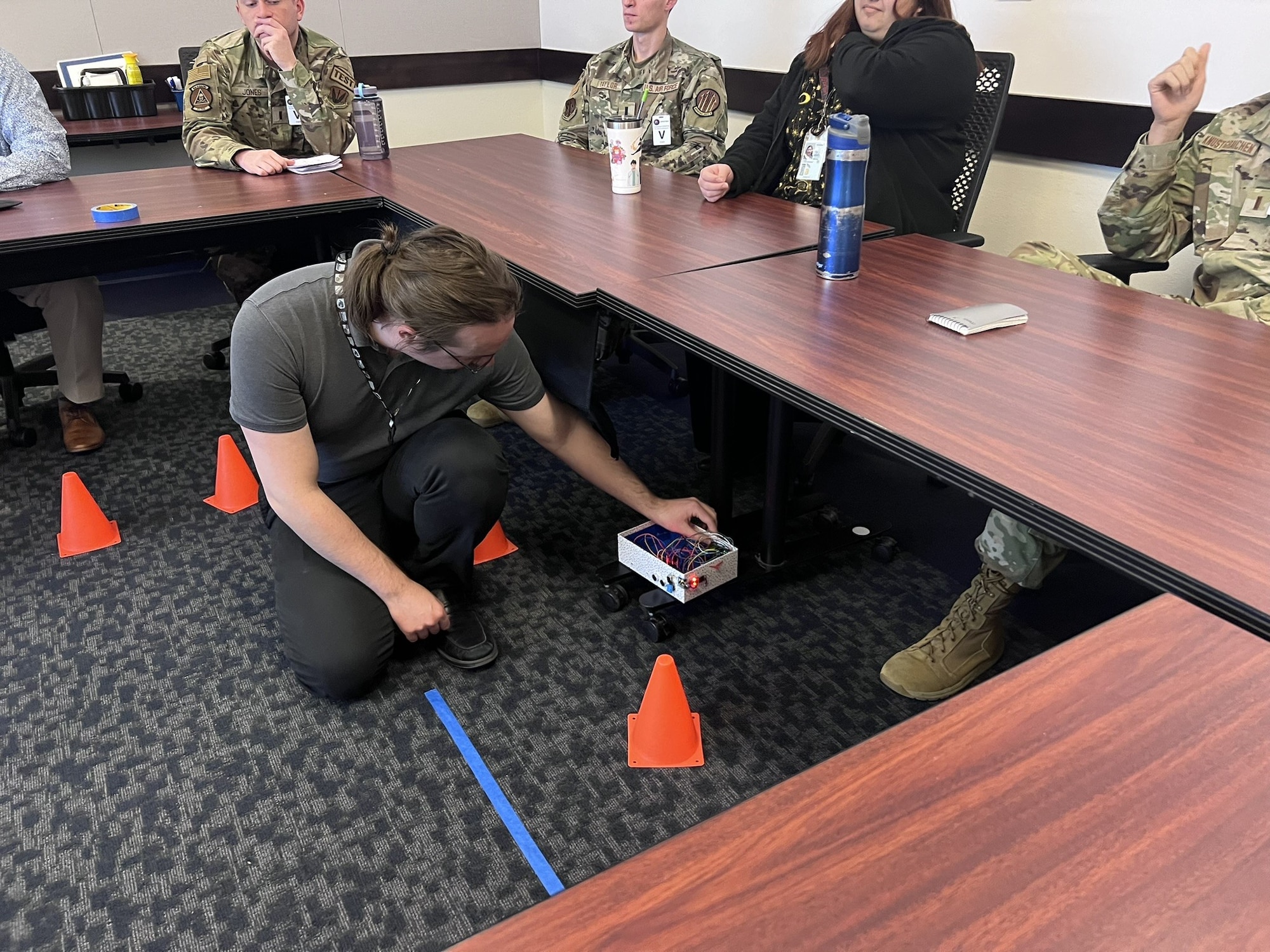 Instructor Shane Melacon readies the off-board sensor suite for developmental test data collection as part of an operational assessment which is an early opportunity for operational testers to gain insight into the operation and performance of a new system.