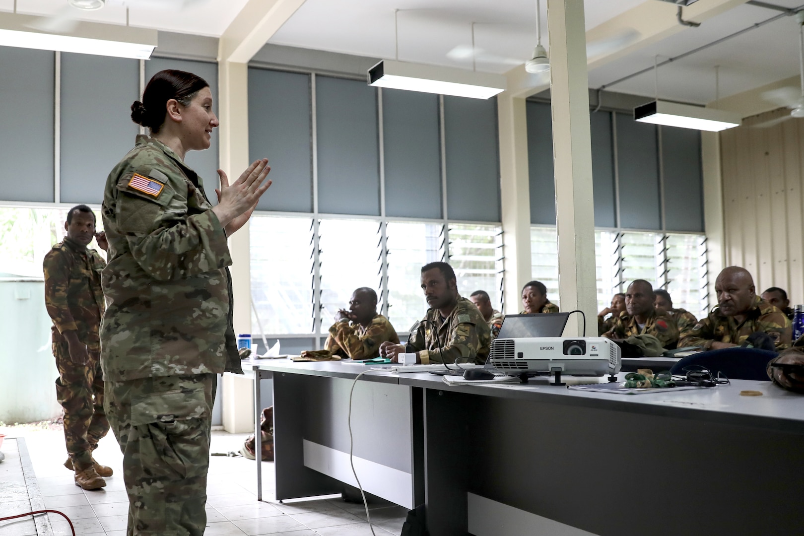 Sgt. 1st Class Lindsey Breivogel, a master resilience trainer course manager with the Wisconsin National Guard’s 426th Regional Training Institute, gives feedback to Papua New Guinea Defence Force medics on their instructor skills March 21 during a recent visit by 40 Wisconsin National Guard members to Papua New Guinea in support of the State Partnership Program. This current exchange includes meetings between leadership along with training in instruction, medical, security forces, and collaboration with senior non-commissioned officers. The Wisconsin National Guard and Papua New Guinea began their partnership in 2020 and have since had several key leader engagements and site visits to strengthen that relationship. Wisconsin National Guard photo by Staff Sgt. Kati Volkman