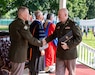 Chap. (Lt. Col.) Raymond Leach (right), deputy command chaplain and regional chaplain personnel manager for the U.S. Army Reserve’s 99th Readiness Division, receives his diploma during the U.S. Army War College graduation ceremony July 28, 2023, at Carlisle Barracks, Pennsylvania. “Since the Army’s work today is so very diverse and often is focused on providing human care and support across the globe, Chaplains are essential personnel at every level and in every mission,” Leach said. (Photo credit: U.S. Army War College)