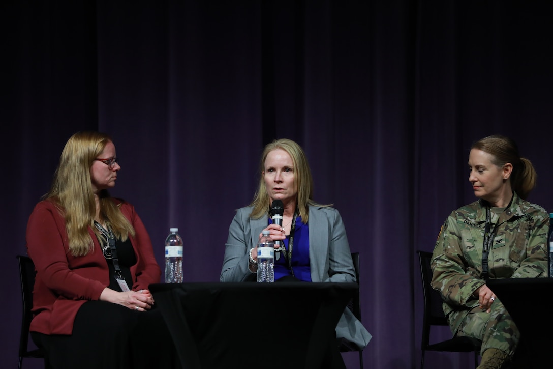 Retired Chief Master Sgt. Meredith Conn speaks during a panel discussion at the Wisconsin Army National Guard's first ever Women's Symposium, March 29, 2024. The events focus was on reinforcing the organization's commitment to gender equality and empowering leaders, women, and allies to advocate for one another. (U.S. National Guard photo by Staff Sgt. Amber Peck)