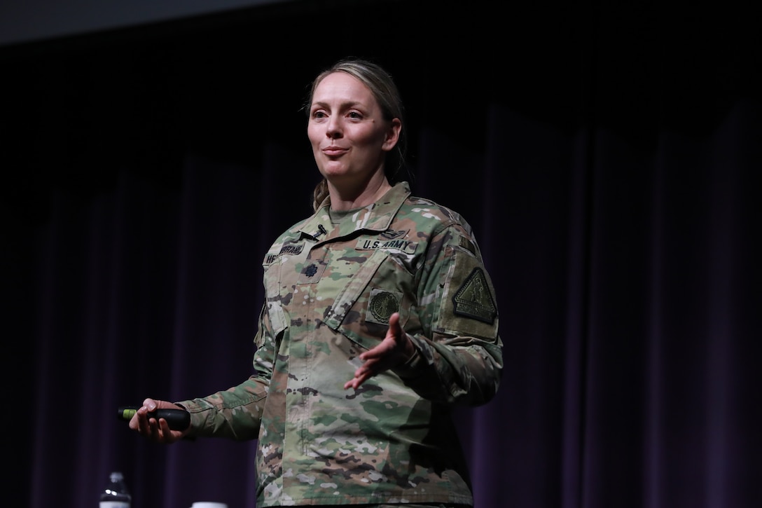 Lt. Col. Shannon Hellenbrand, Wisconsin Army National Guard’s Diversity Advisory Team leader and the only National Guard officer on the Army’s Women’s Initiative Team, speaks to the 150+ attendees about struggles and vulnerability during the Wisconsin Army National Guard's first ever Women's Symposium, March 29, 2024. The events focus was on reinforcing the organization's commitment to gender equality and empowering leaders, women, and allies to advocate for one another. (U.S. National Guard photo by Staff Sgt. Amber Peck)