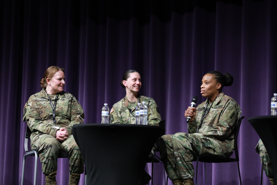 Two Wisconsin National Guard members (left and right) and the Active Army Drill Sergeant of the Year (center) take part in a panel discussion at the Wisconsin Army National Guard's first ever Women's Symposium, March 29, 2024. The events focus was on reinforcing the organization's commitment to gender equality and empowering leaders, women, and allies to advocate for one another. (U.S. National Guard photo by Staff Sgt. Amber Peck)