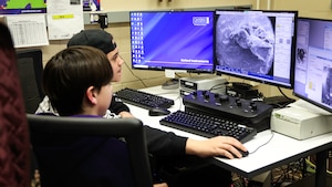 Students from Baker Middle School in Fairborn, Ohio, learn about and use a scanning electron microscope, or SEM, as part of the Scanning Electron Microscope Educators, or SEMEDS, program at Wright-Patterson Air Force Base, Dayton, Ohio. The after-school program gives area middle and high school students a rare opportunity to experience firsthand what it's like to use a $500,000 SEM to explore a wide-variety of unique and everyday specimens. The program was recently revived after a hiatus due to the COVID-19 pandemic. (U.S. Air Force photo / Terrance Auster)