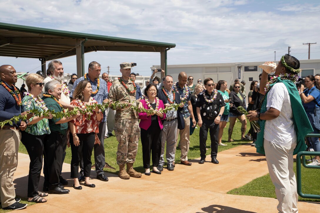A Hawaiian dedication ceremony, which included pū and ‘oli, for the temporary King Kamehameha III Elementary School led by cultural practitioner Kaniala Masoe of Maui. (USACE photo by Makenzie Leonard)