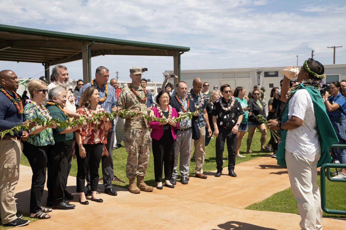 A Hawaiian dedication ceremony, which included pū and ‘oli, for the temporary King Kamehameha III Elementary School led by cultural practitioner Kaniala Masoe of Maui. (USACE photo by Makenzie Leonard)