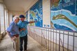 Dr. Stanley Allen, a U.S. Army WWII veteran, tours the National Memorial Cemetery of the Pacific with Gene Maestas, the NMCP public affairs specialist, in Honolulu, Hawaii, March 19, 2024.