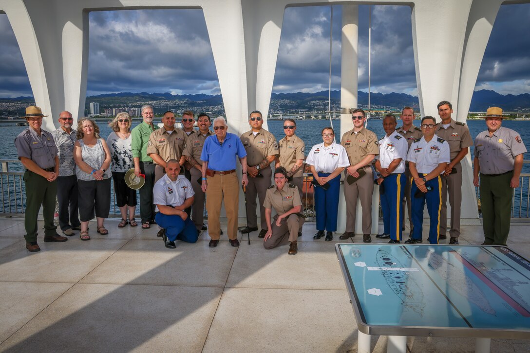 Dr. Stanley Allen (middle), a U.S. Army WWII veteran, tours USS Arizona at the Pearl Harbor National Memorial (U.S. National Park Service) in Honolulu, Hawaii, with Soldiers assigned to 3rd Battalion, 25th Aviation Regiment, 25th Combat Aviation Brigade, 25th Infantry Division, March 19, 2024.