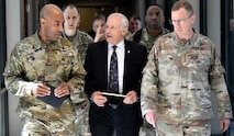 Lt. Gen. Sean A. Gainey, commanding general, U.S. Army Space and Missile Defense Command, and Rick De Fatta, deputy to the commanding general, walk with Gen. Gregory M. Guillot, commander, North American Aerospace Defense Command and U.S. Northern Command, at SMDC’s Redstone Arsenal, Alabama, headquarters, Mar. 28. This was Guillot’s first visit to the command where he also toured the Space and Missile Defense Center of Excellence’s Joint Air Defense Operations Center – Developmental Laboratory, which provides a live-test environment for the battle management systems employed by National Capital Region Integrated Air Defense System. (U.S. Army photo by Jason B. Cutshaw)