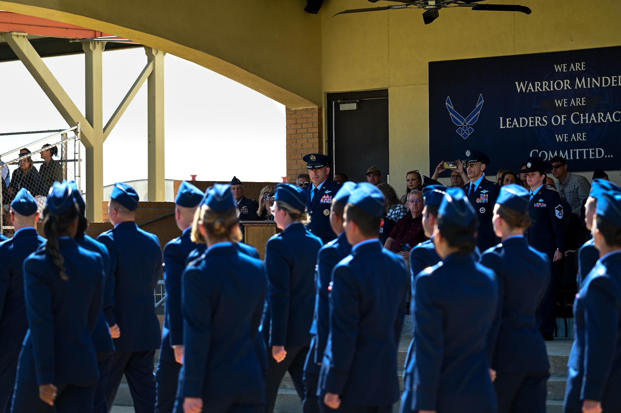 U.S. Air Force Col. Josh Koslov, 350th Spectrum Warfare Wing commander, reviews U.S. Air Force Officer Training School trainees during their pass and review, part of the graduation parade at Maxwell Air Force Base, AL, March 28, 2024. The program consists of five modules that build upon each other and emphasis teamwork, communication, decision-making, resiliency, creative thinking and accountability. (U.S. Air Force photo by Capt. Benjamin Aronson)