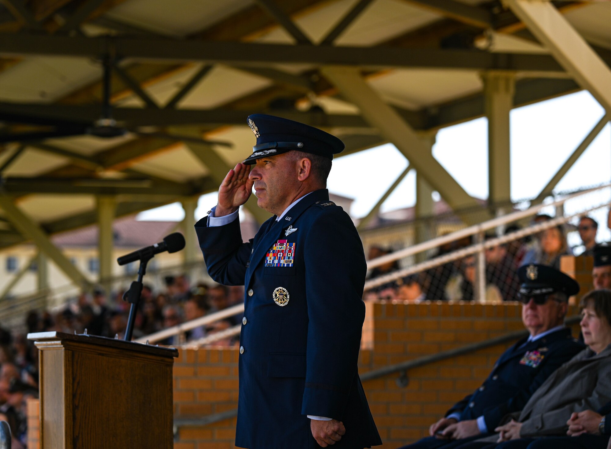 U.S. Air Force Col. Josh Koslov, 350th Spectrum Warfare Wing commander, salutes the U.S. Air Force Officer Training School trainee wing during the graduation parade at Maxwell Air Force Base, AL, March 28, 2024. The program consists of 30 hours of pre-requisite distance learning and eight weeks of military training and leadership development for college graduates. (U.S. Air Force photo by Capt. Benjamin Aronson)