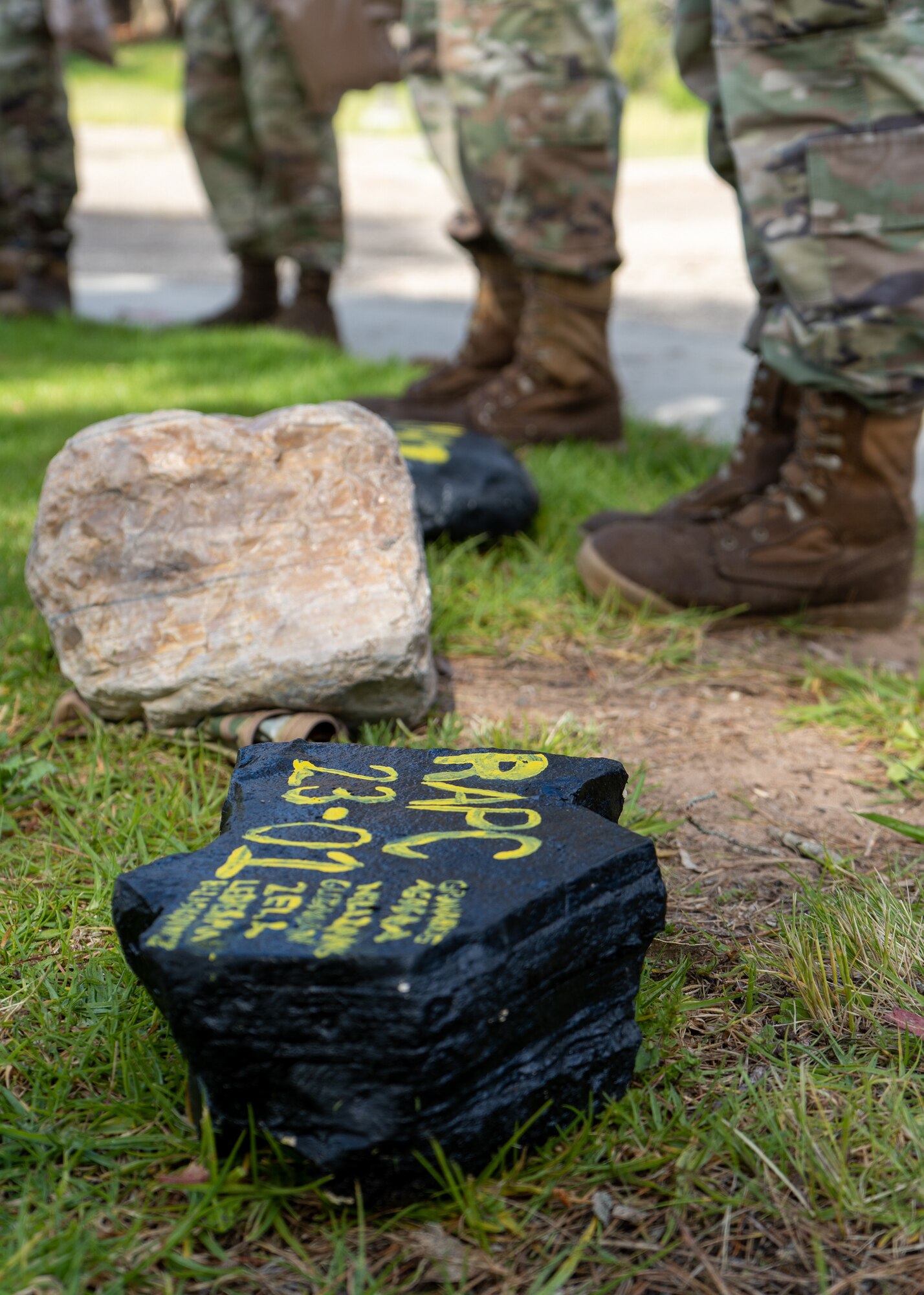 A rock is displayed on the ground.