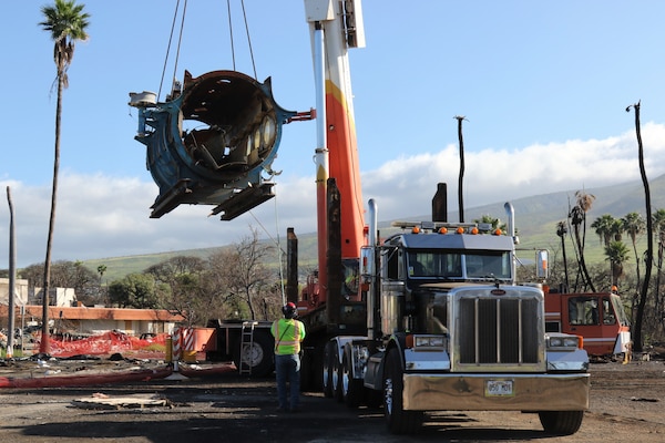 U.S. Army Corps of Engineers contractors remove a submarine during vessel debris removal operations near the harbor in Lahaina, Hawai‘i, Feb. 18, 2024. The submarine was one of the fleet of commercial tourist submarines for citizens and tourists to view marine life around Maui. To ensure debris removal operations are conducted safely, there is significant coordination and safety planning between USACE and the contractor performing the work. USACE is overseeing the debris removal mission under a FEMA Federal Emergency Management Agency mission assignment, which is part of a coordinated effort with the Hawaii Emergency Management Agency, the County of Maui  and the U.S. Environmental Protection Agency to clean up areas of the island affected by the Aug. 8, 2023, wildfires. (USACE Photo by Robert DeDeaux)