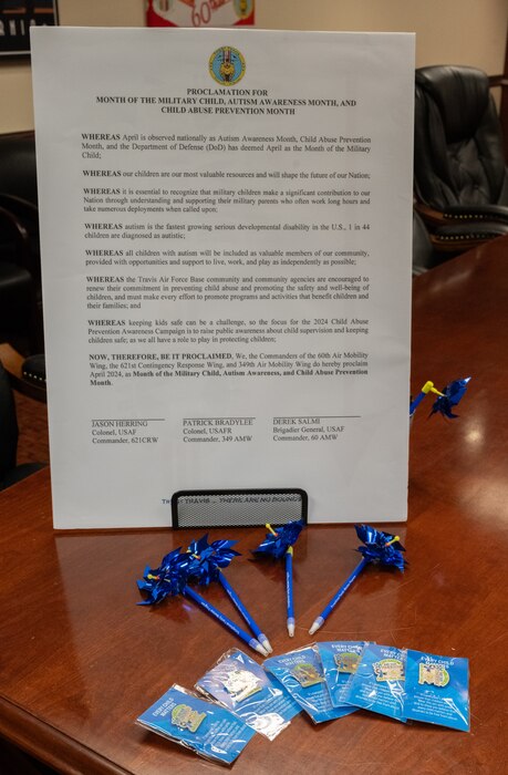 Military Child, Autism Awareness Month and Child Abuse Prevention Month proclamation sits among related swag at Travis Air Force Base