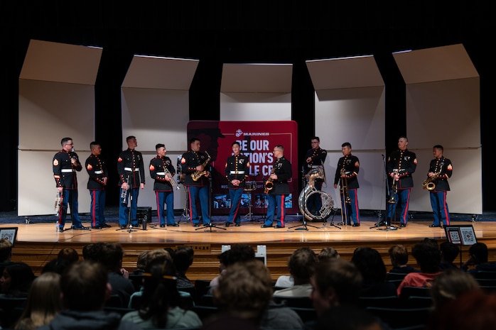 U.S. Marines assigned to Marine Band San Diego speak to students following their performance at Mounds View High School in Arden Hills, Minnesota, March 20, 2024. Marine Band San Diego's performances at high schools nationwide allow them to connect with and inspire students and their communities while also promoting the opportunities the Marine Corps has to offer. (U.S. Marine Corps photo by Lance Cpl. Francisco Angel)