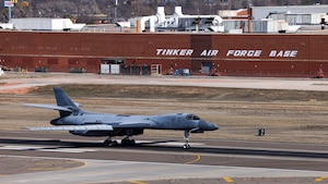 B-1B aircraft landing on runway