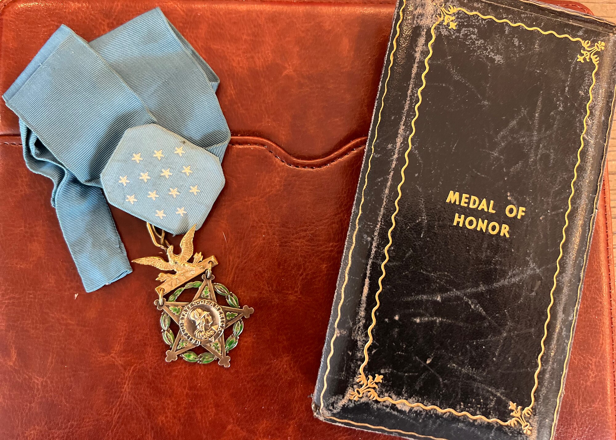 medal of honor and case on a red background