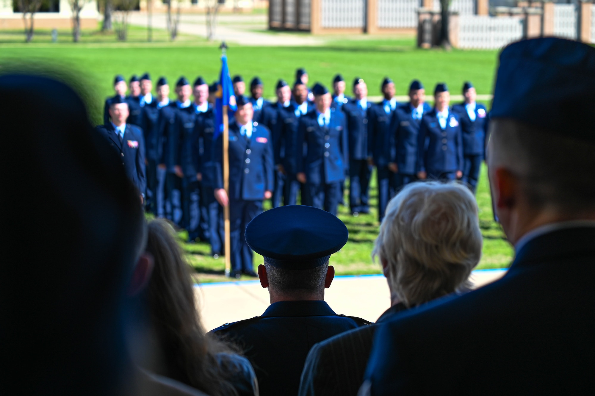 U.S. Air Force Col. Josh Koslov, 350th Spectrum Warfare Wing commander, reviews U.S. Air Force Officer Training School trainees during their pass and review, part of the graduation parade at Maxwell Air Force Base, AL, March 28, 2024. The program consists of five modules that build upon each other and emphasis teamwork, communication, decision-making, resiliency, creative thinking and accountability. (U.S. Air Force photo by Capt. Benjamin Aronson)