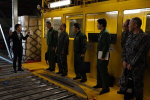 A photo of Airmen and Japanese Air Self-Defense Force personnel.