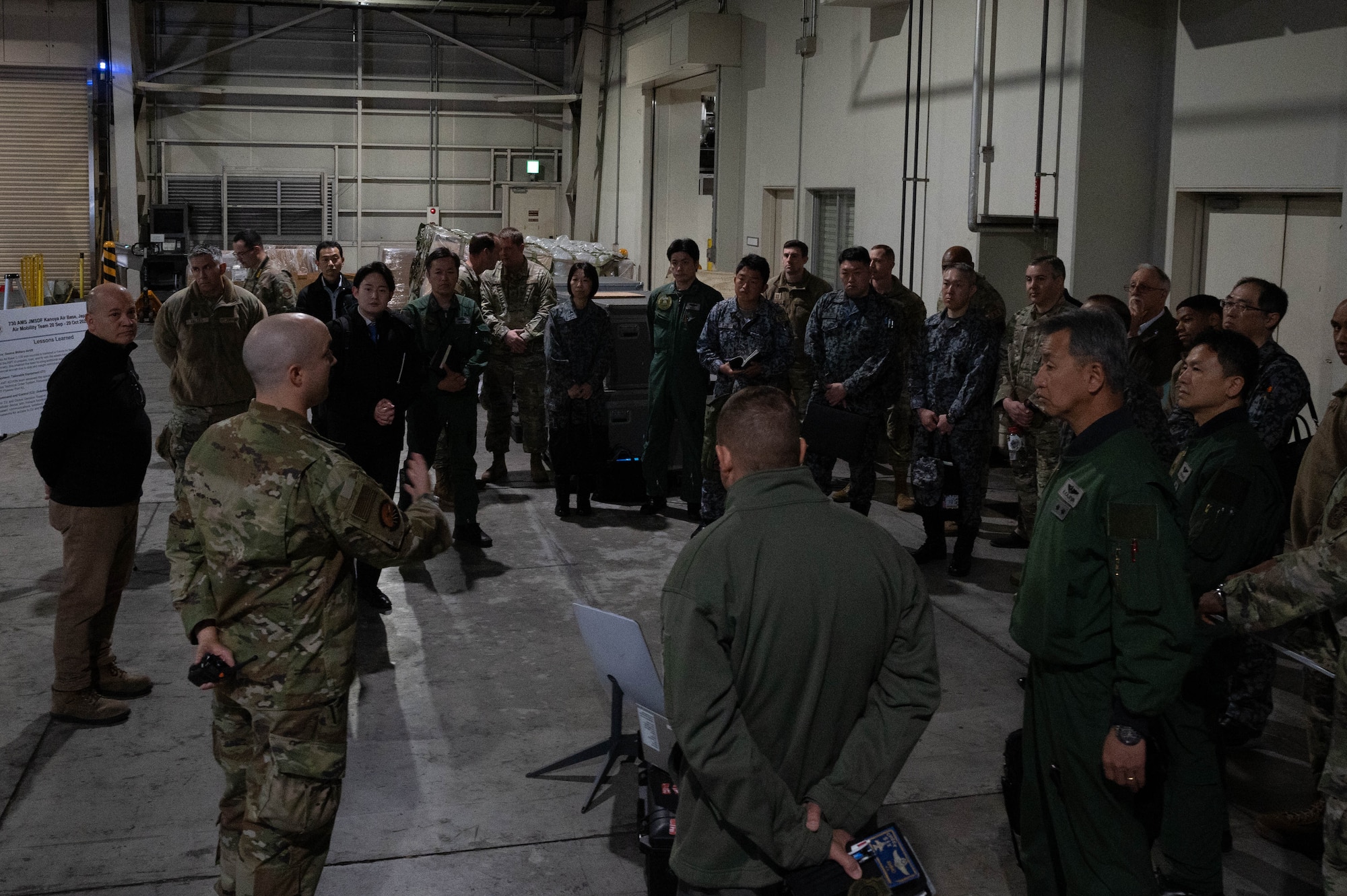 A photo of Airmen and Japanese Air Self-Defense Force personnel.