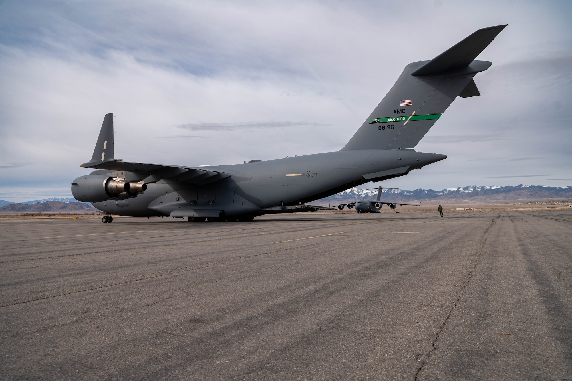 A photo of a C-17 offloading a fuel truck