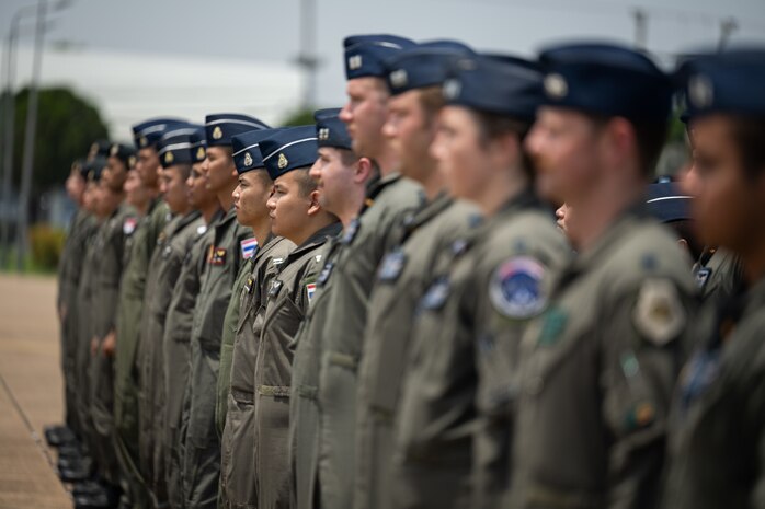 Airmen from the Royal Thai Air Force, Republic of Singapore Air Force and U.S. Air Force stand in formation during the closing ceremony for Cope Tiger 2024 at Korat Royal Thai Air Force Base, Thailand, March 29, 2024. This year the U.S. came as a Total Force package with the Washington Air National Guard KC-135 Stratotankers participating. Flying nine missions, they were there to assist in refueling operations with our Allies and partners, offloading 225.9klb of fuel to 69 receivers from all three nations’ aircraft. (U.S. Air Force photo by Tech. Sgt. Hailey Haux)