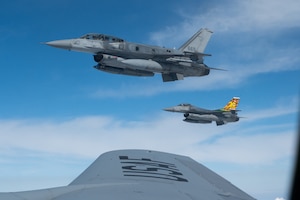 Two Republic of Singapore Air Force F-16s fly alongside a Washington Air National Guard KC-135 Stratotanker during Cope Tiger 2024, Korat Royal Thai Air Base, Thailand, March 26, 2024. The U.S. commitment to the Indo-Pacific and our Allies and partners is ironclad, and we will remain engaged in the region. (U.S. Air Force photo by Tech. Sgt. Hailey Haux)