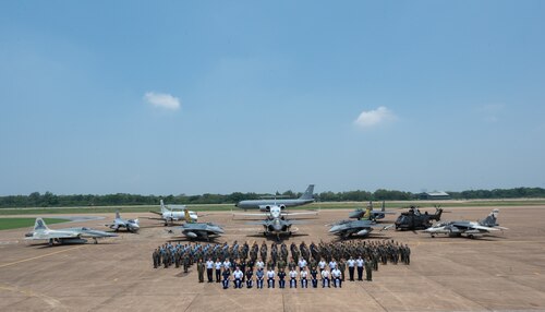 Airmen from the Royal Thai Air Force, Republic of Singapore Air Force and U.S. Air Force stand in formation during the closing ceremony for Cope Tiger 2024 at Korat Royal Thai Air Force Base, Thailand, March 29, 2024. CT24 provides effective, flexible, and capabilities-centered combined forces, ready for deployment world-wide, and enables real-world proficiency in response to a variety of crises. (U.S. Air Force photo by Tech. Sgt. Hailey Haux)