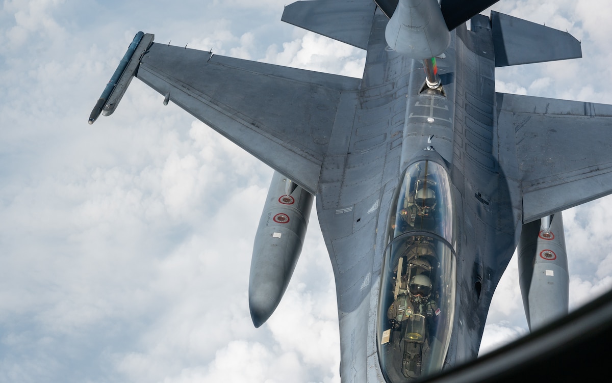 A Republic of Singapore Air Force F-16 gets refueled by a Washington Air National Guard KC-135 Stratotanker during Cope Tiger 2024, Korat Royal Thai Air Base, Thailand, March 26, 2024. Cope Tiger builds relationships and promotes our capacity for security and interoperability by demonstrating our regional commitment. (U.S. Air Force photo by Tech. Sgt. Hailey Haux)