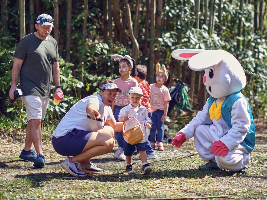 Children and their parents participate in an egg hunt at Commander, Fleet Activities Yokosuka's Ikego West Valley Campground March 31, 2024 during Egg'Stravaganza.